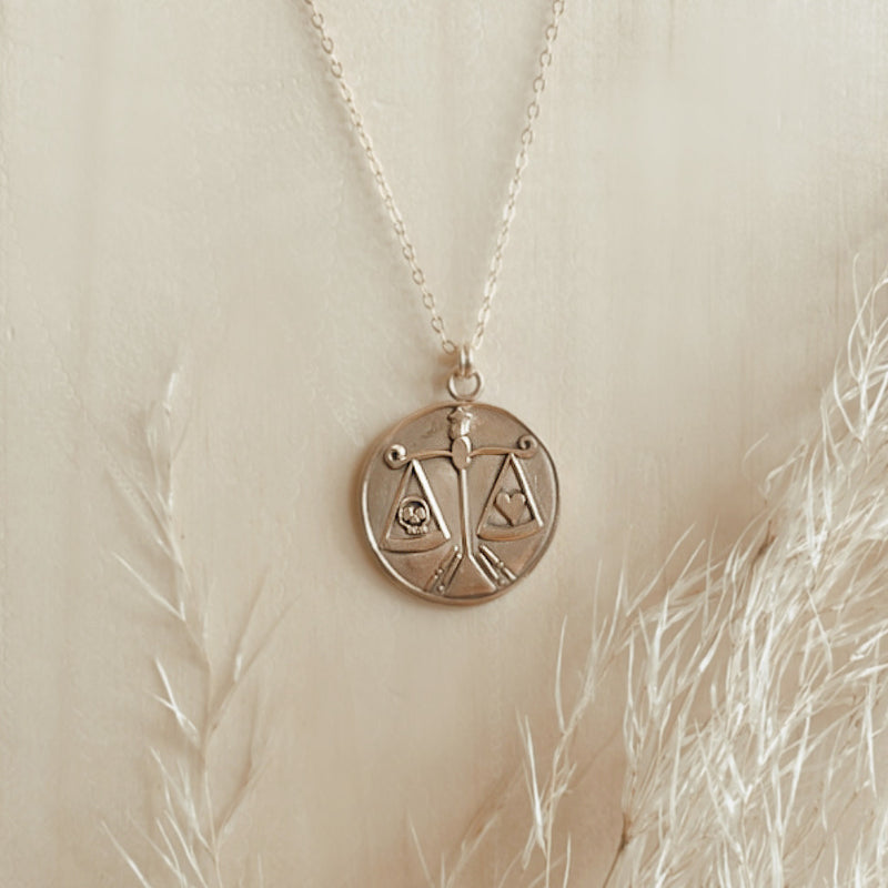 head vs heart talisman necklace