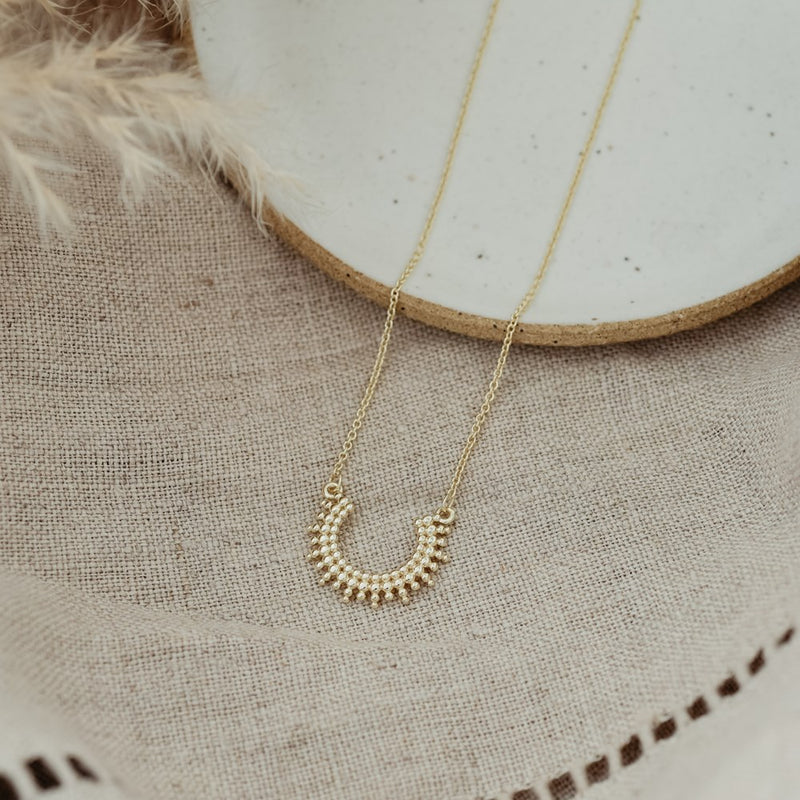 curved luck necklace