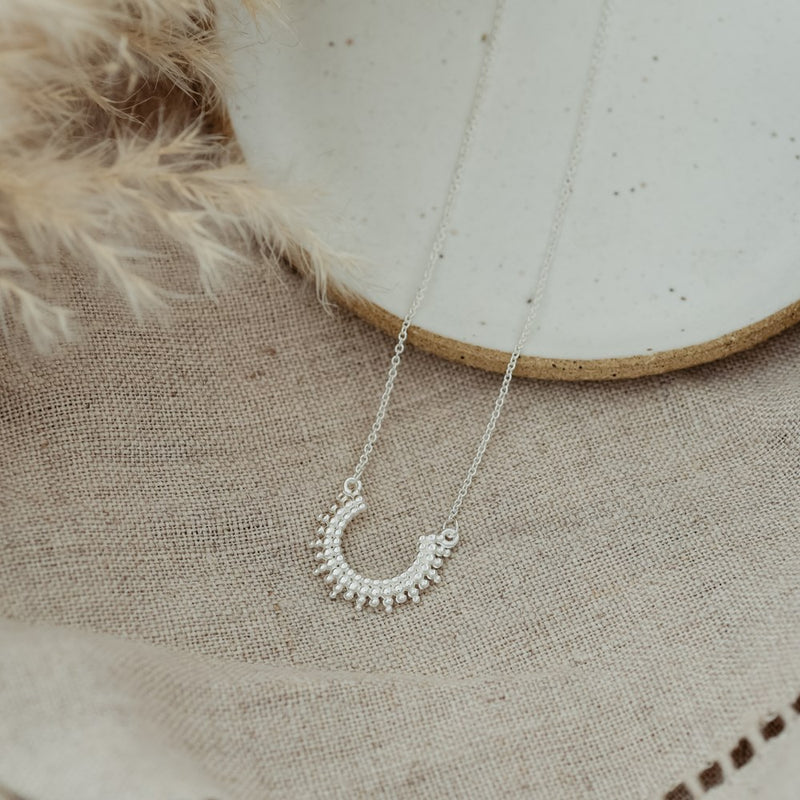 curved luck necklace